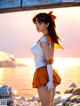 A woman in a sailor outfit standing on a beach.